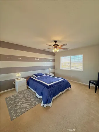 a living room with a couch and chandelier