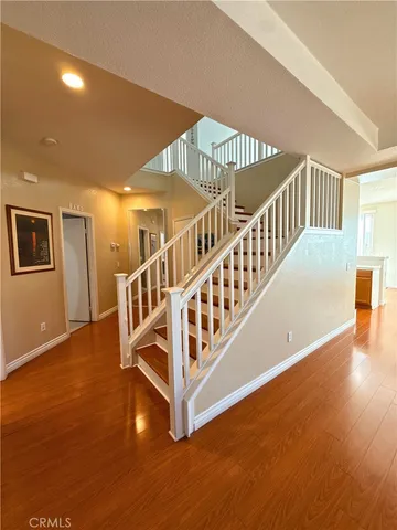 a view of an entryway with wooden floor