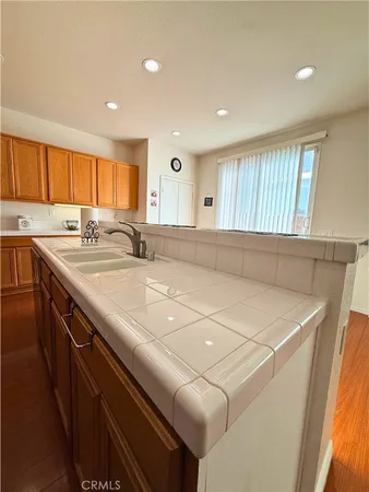 a kitchen with a sink and a window