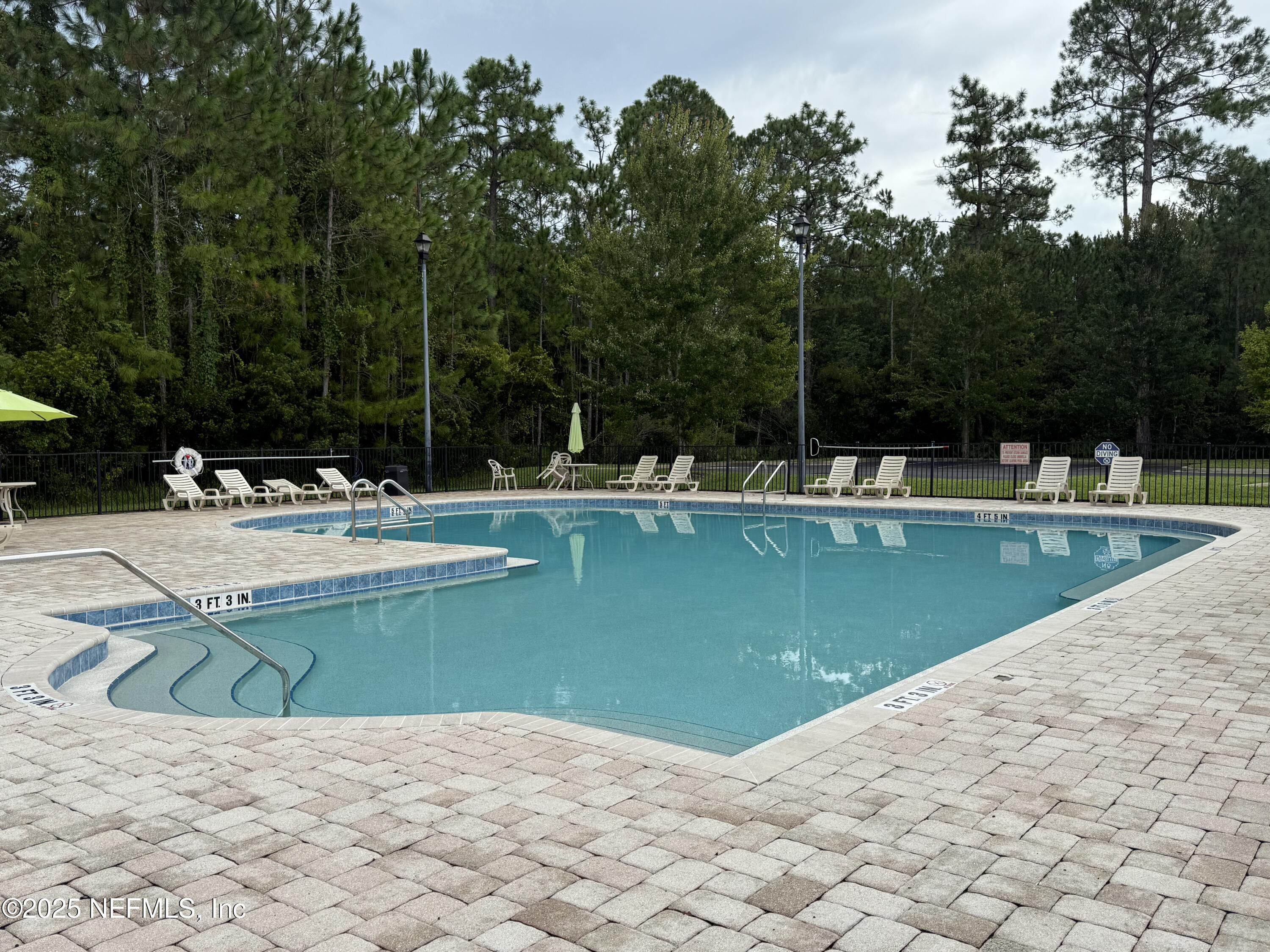2564 Golden Lake Loop St. Augustine, FL 32084 - Photo 20 of 24 a view of a swimming pool with a patio