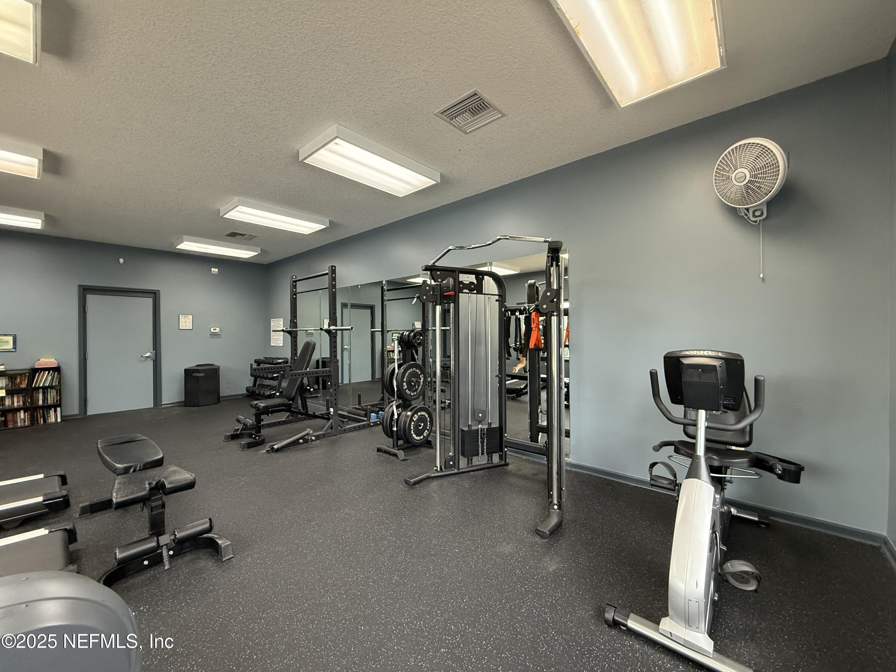 2564 Golden Lake Loop St. Augustine, FL 32084 - Photo 23 of 24 a view of a room with gym equipment
