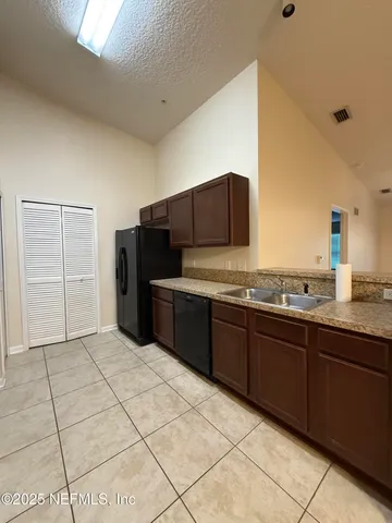 a kitchen with stainless steel appliances a sink and cabinets