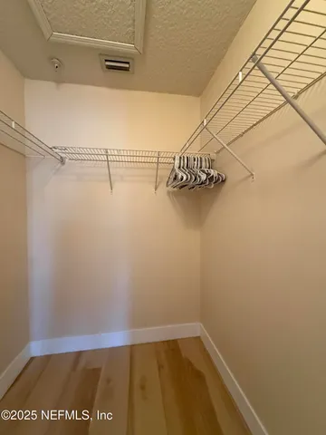 a view of a room with racks on the wall