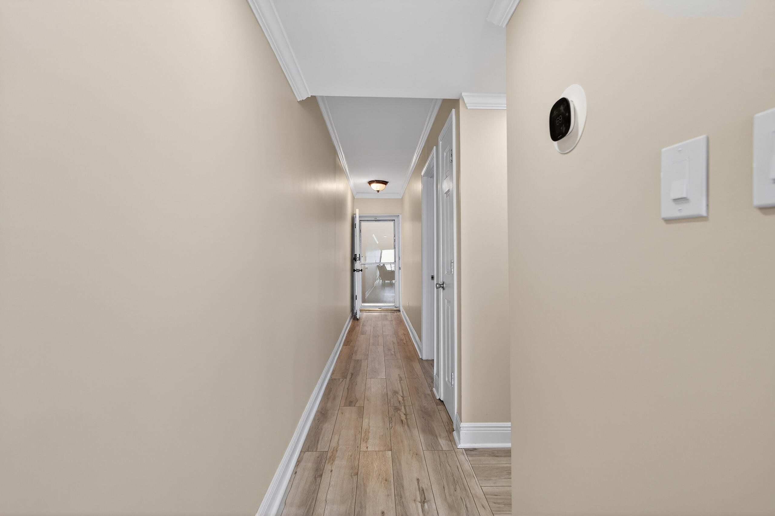 151 Calhoun Avenue, Unit 301 Destin, FL 32541 - Photo 17 of 43 a view of a hallway with wooden floor and closet