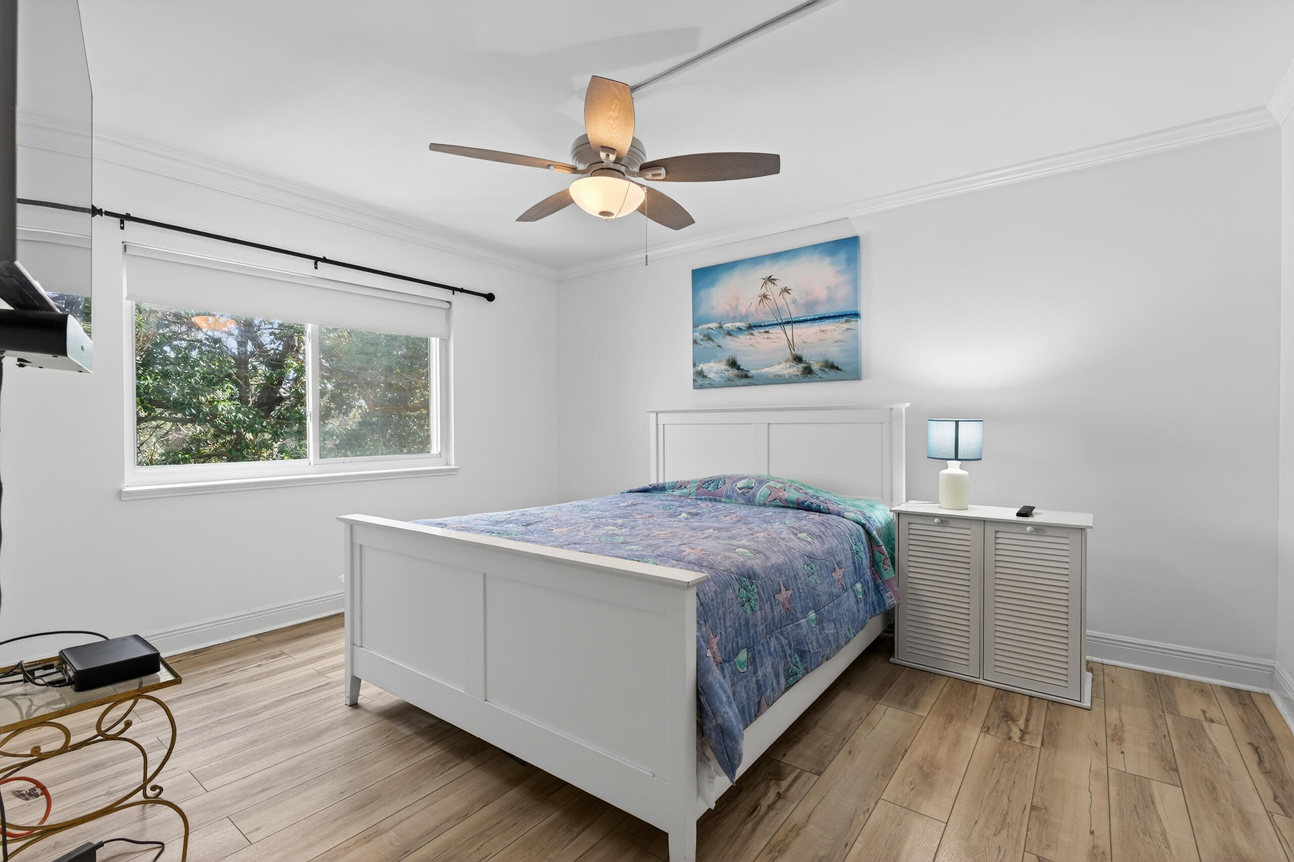 151 Calhoun Avenue, Unit 301 Destin, FL 32541 - Photo 18 of 43 a bedroom with a bed and a window