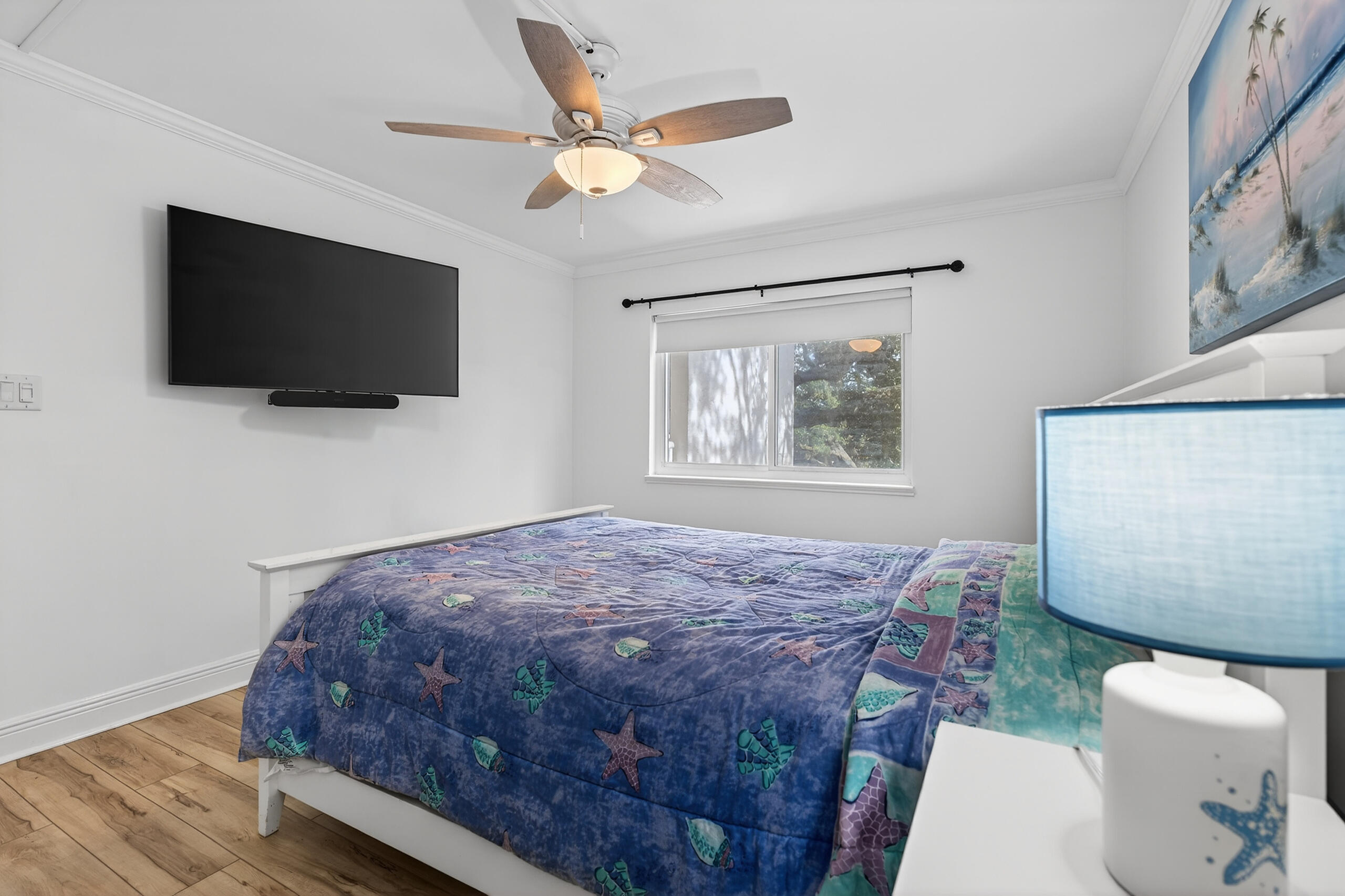 151 Calhoun Avenue, Unit 301 Destin, FL 32541 - Photo 20 of 43 a bedroom with a large bed and a flat screen tv