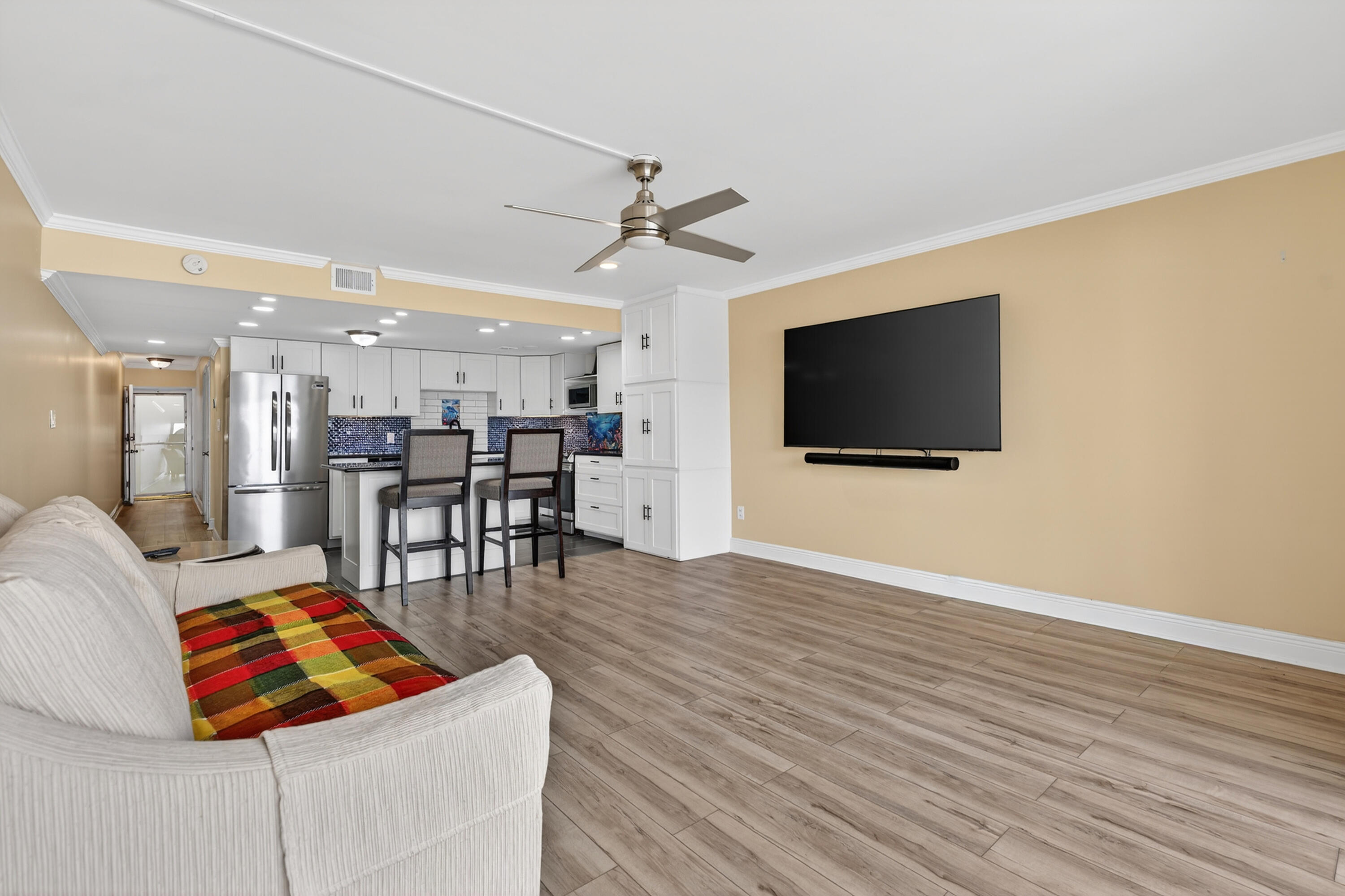 151 Calhoun Avenue, Unit 301 Destin, FL 32541 - Photo 7 of 43 a living room with furniture and a flat screen tv