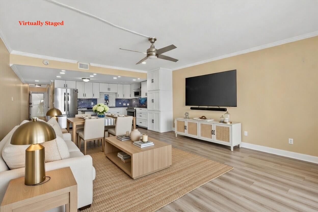 151 Calhoun Avenue, Unit 301 Destin, FL 32541 - Photo 8 of 43 a living room with furniture and a flat screen tv