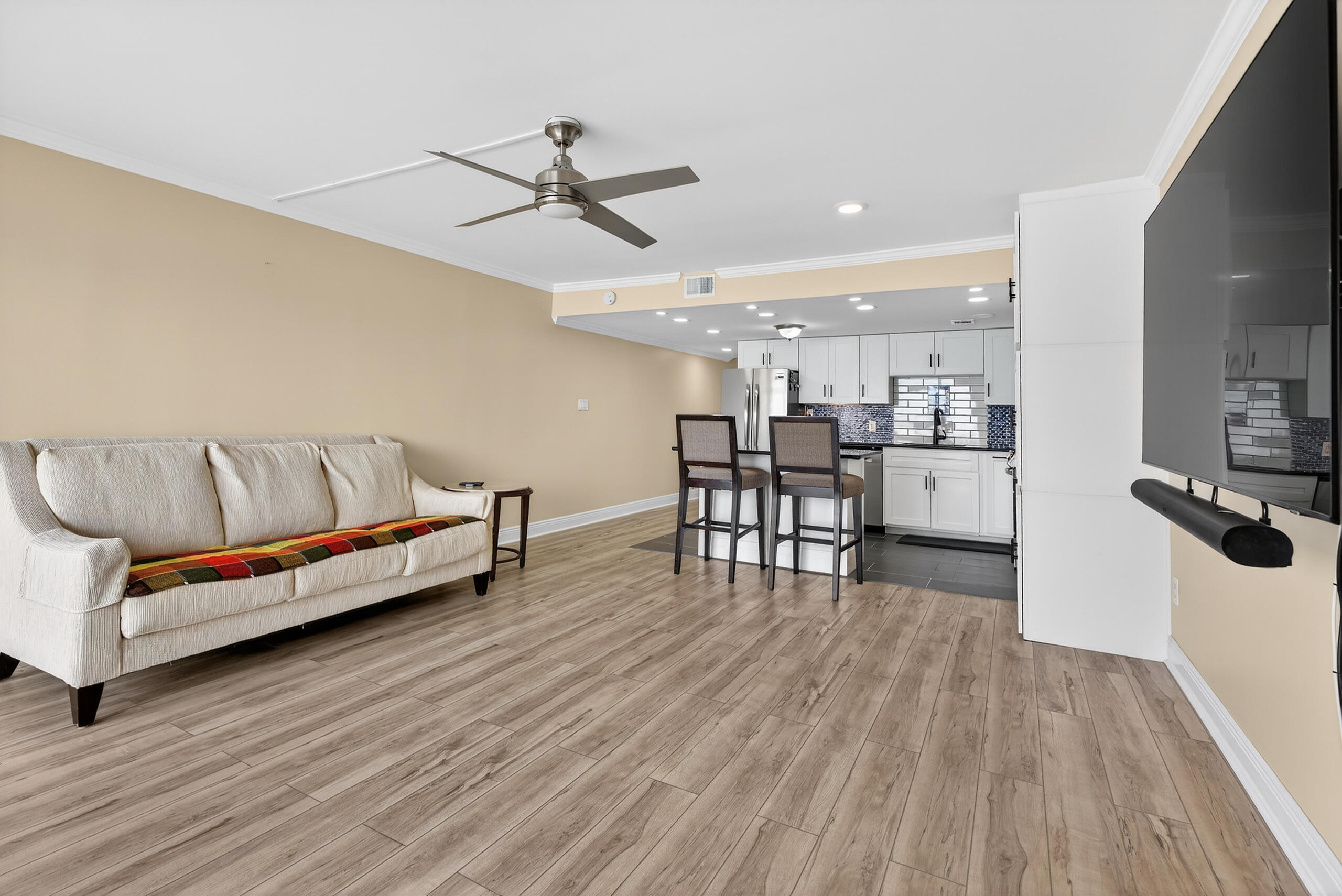 151 Calhoun Avenue, Unit 301 Destin, FL 32541 - Photo 9 of 43 a living room with furniture and kitchen view