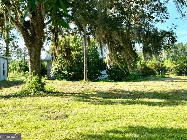 a view of swimming pool from a yard