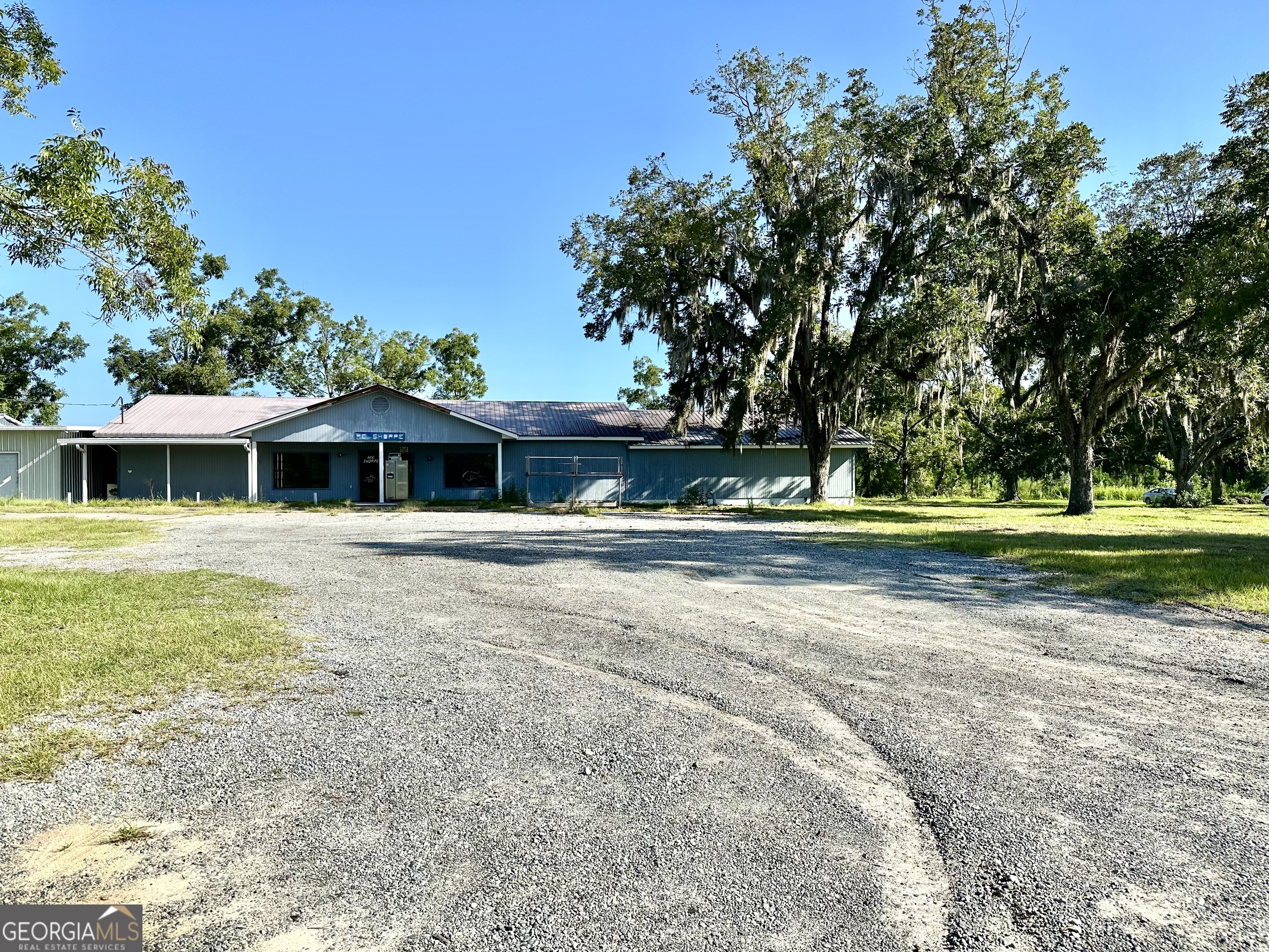 3344 Strickland Avenue Blackshear, GA 31516 - Photo 15 of 17 a front view of a house with a yard
