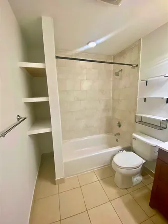a bathroom with a bathtub and toilet