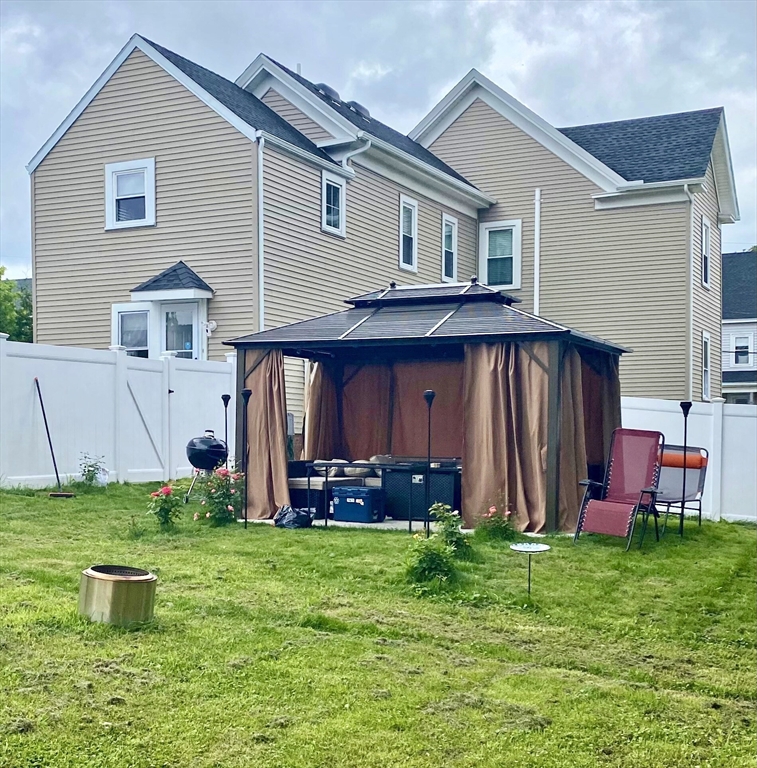 30 Maple Avenue, Unit 2 North Andover, MA 01845 - Photo 17 of 17 a front view of house with yard and outdoor seating