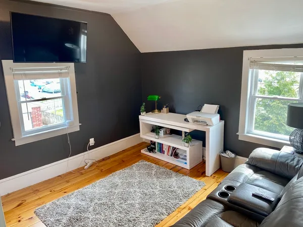 a bed room with furniture and a window