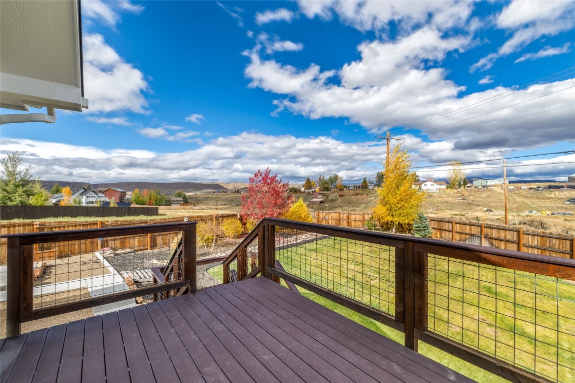 307 Little Bend Road Hayden, CO 81639 - Photo 5 of 41 Deck with a fenced backyard, two RV pads and a greenhouse