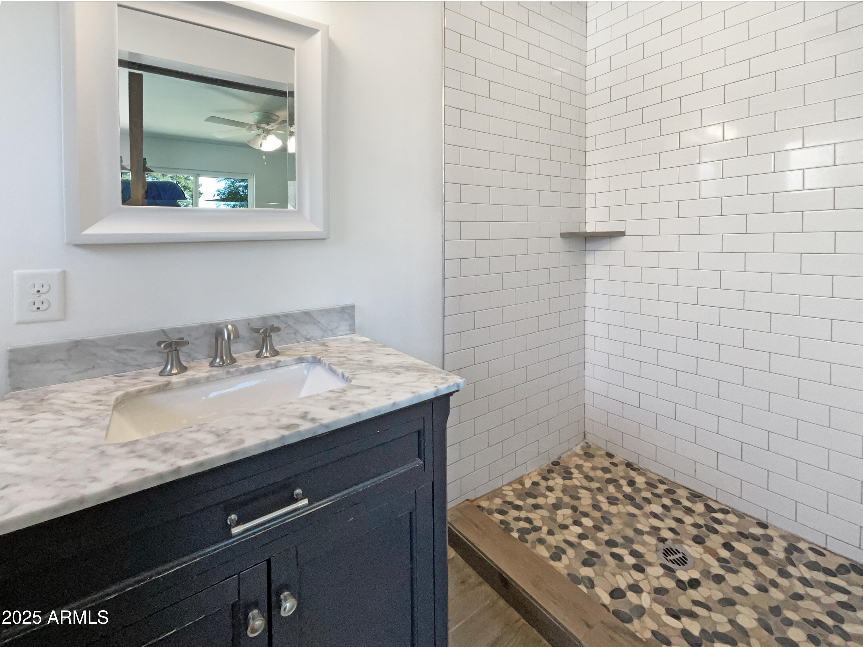 7231 North 23rd Avenue Phoenix, AZ 85021 - Photo 21 of 28 a bathroom with a granite countertop sink a toilet and a mirror