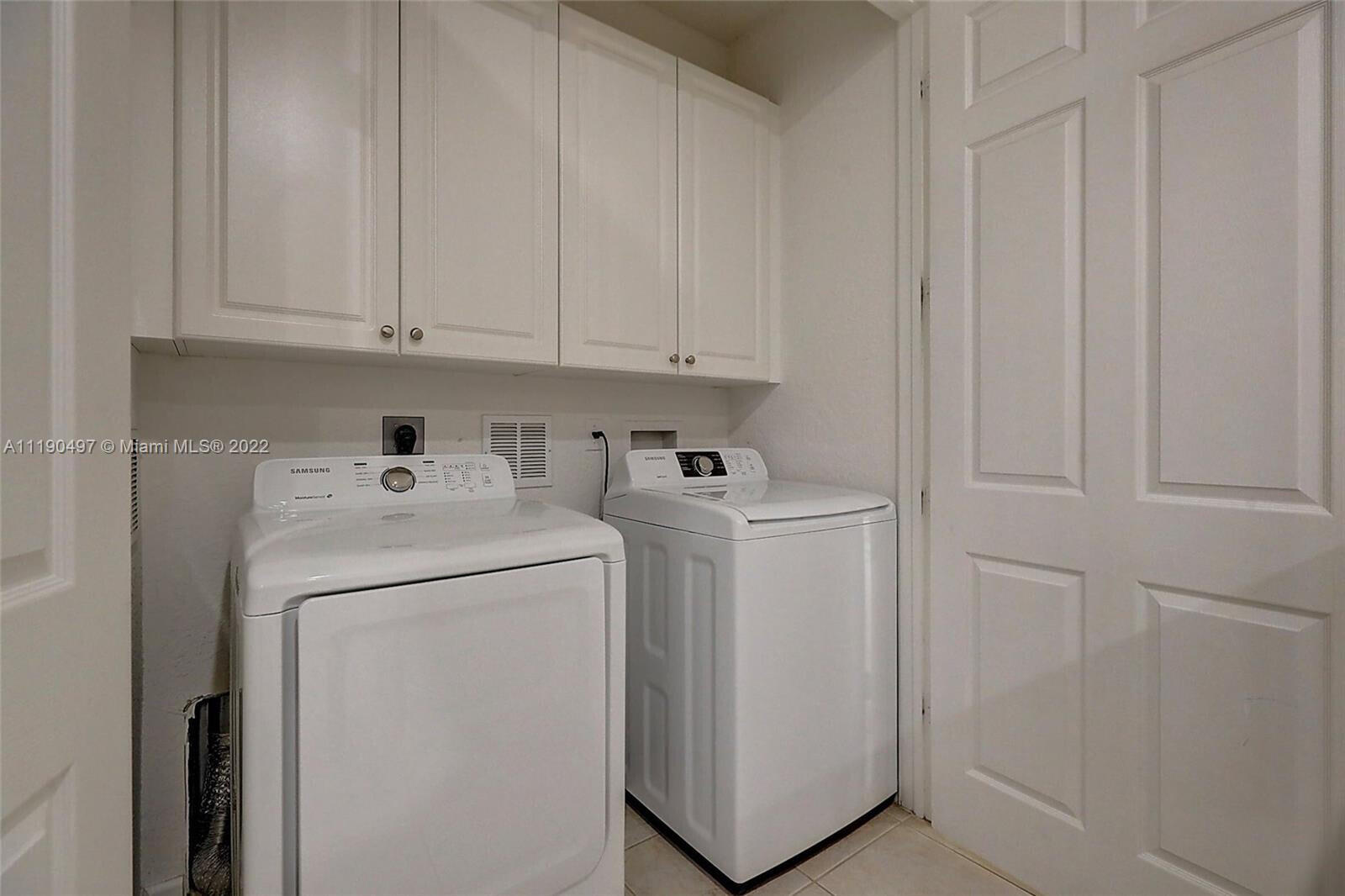 9469 Southwest Purple Martin Way Stuart, FL 34997 - Photo 13 of 21 a utility room with dryer and washer