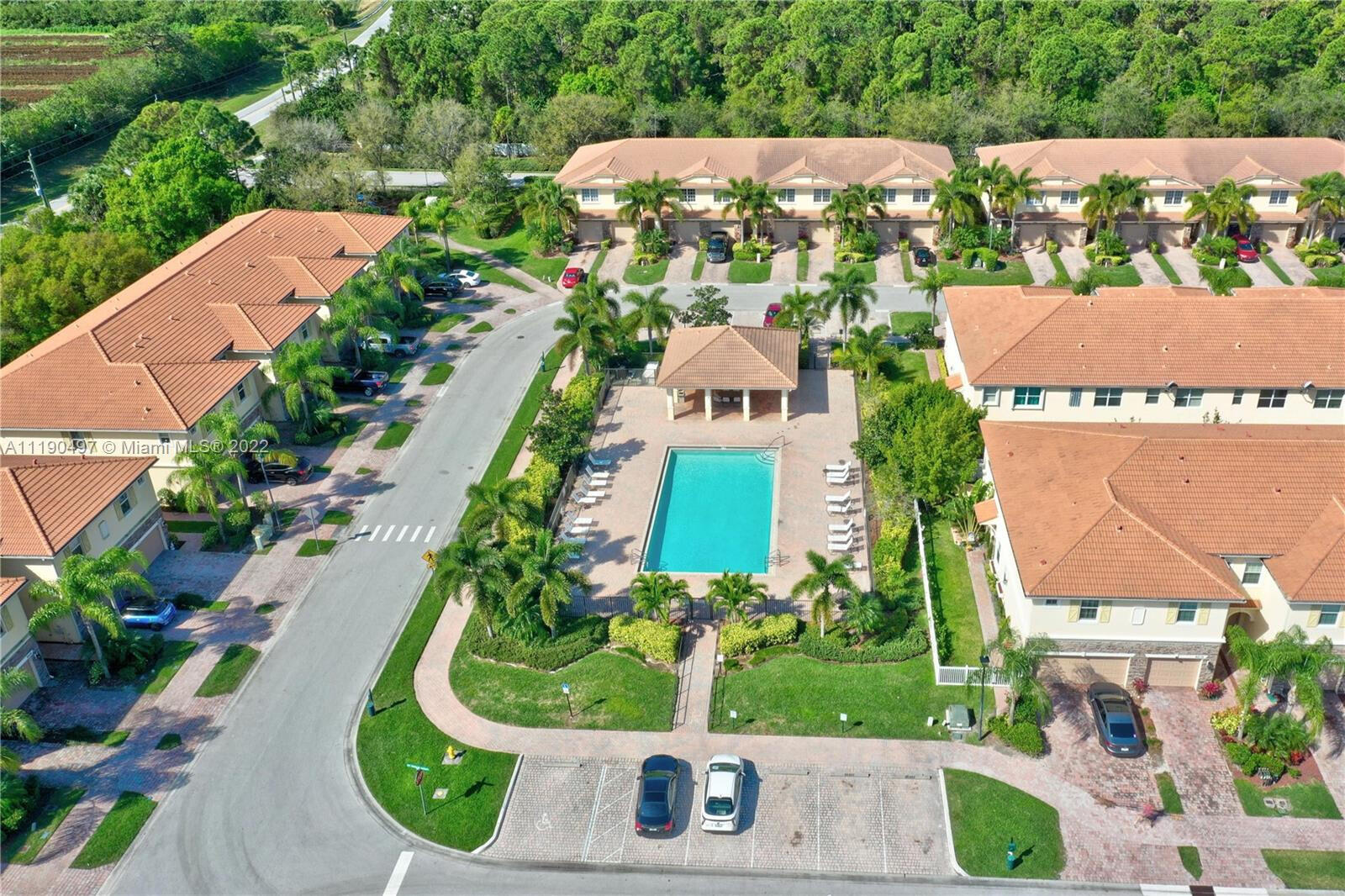 9469 Southwest Purple Martin Way Stuart, FL 34997 - Photo 21 of 21 an aerial view of house with yard and swimming pool