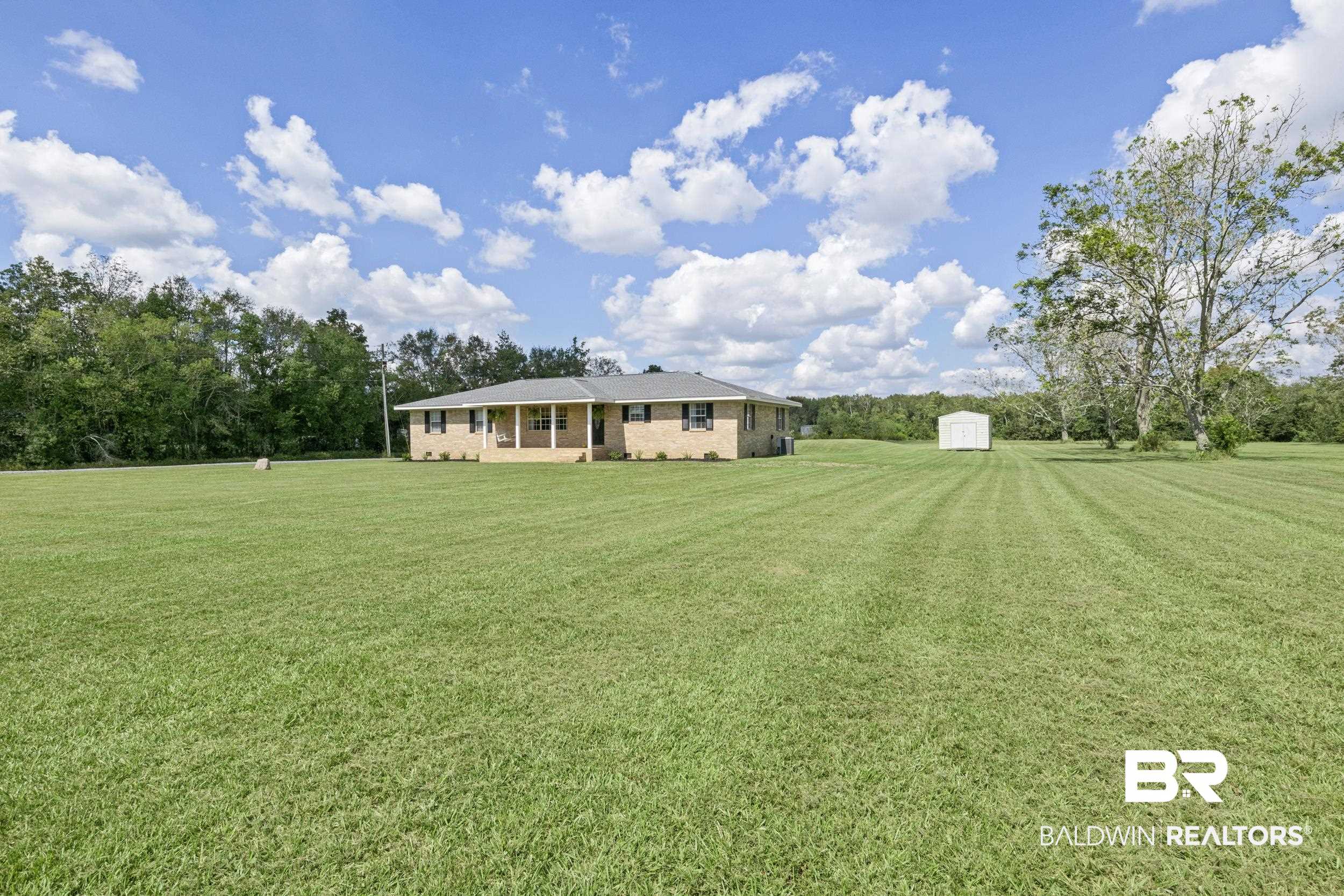 17689 Brewer Road Foley, AL 36535 - Photo 12 of 54 View of yard with a storage shed