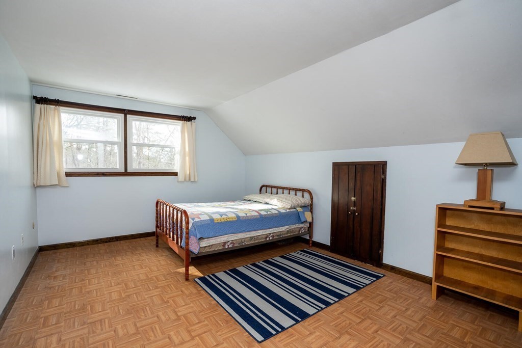 1299 Bay Road Amherst, MA 01002 - Photo 28 of 42 a bedroom with a bed and wooden floor