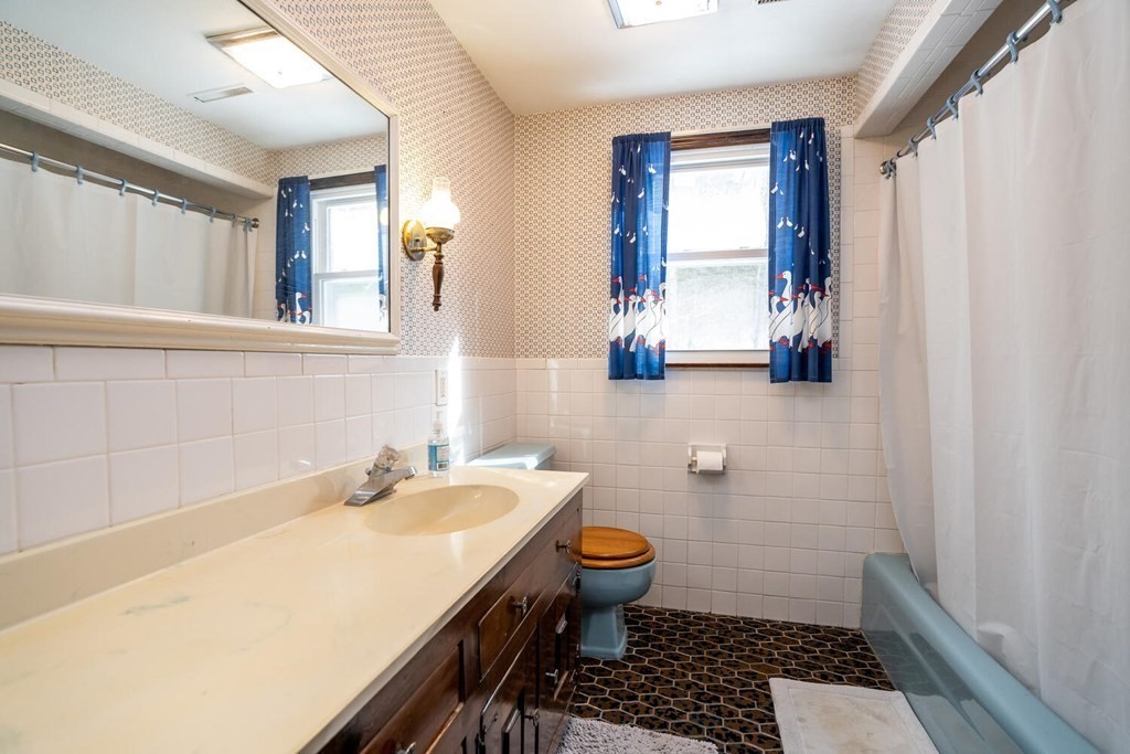 1299 Bay Road Amherst, MA 01002 - Photo 30 of 42 a bathroom with a sink toilet and window
