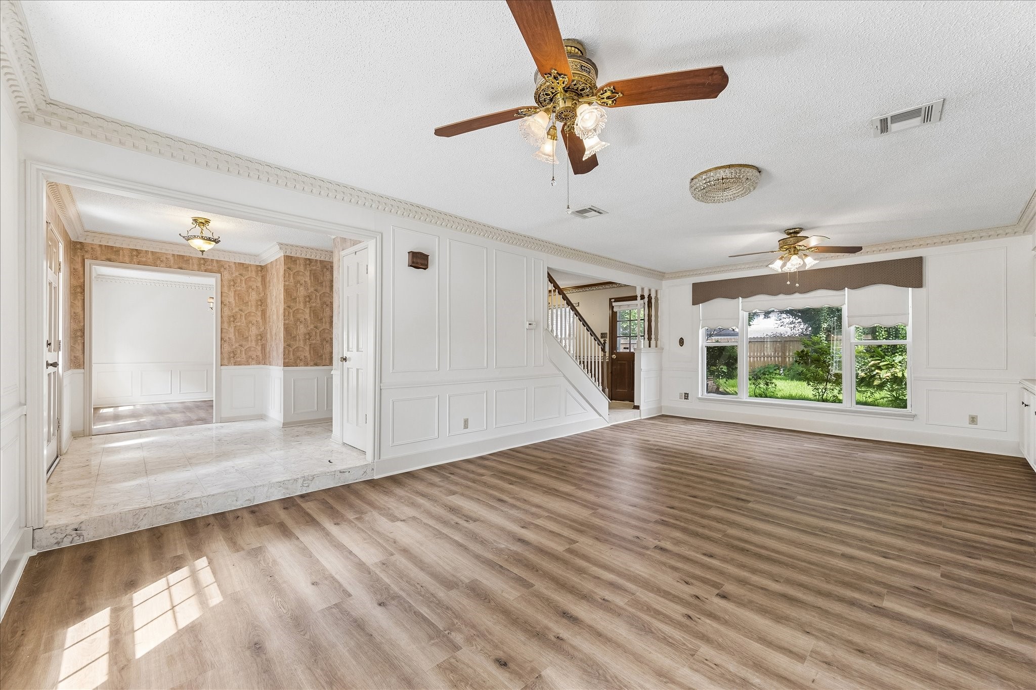 322 Enchanted River Drive Spring, TX 77388 - Photo 12 of 29 Living Room and Foyer looking into the dining room