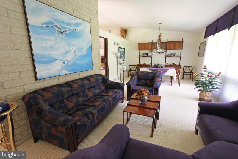 412 Whitaker Mill Road Fallston, MD 21047 - Photo 7 of 25 a living room with furniture and a fireplace