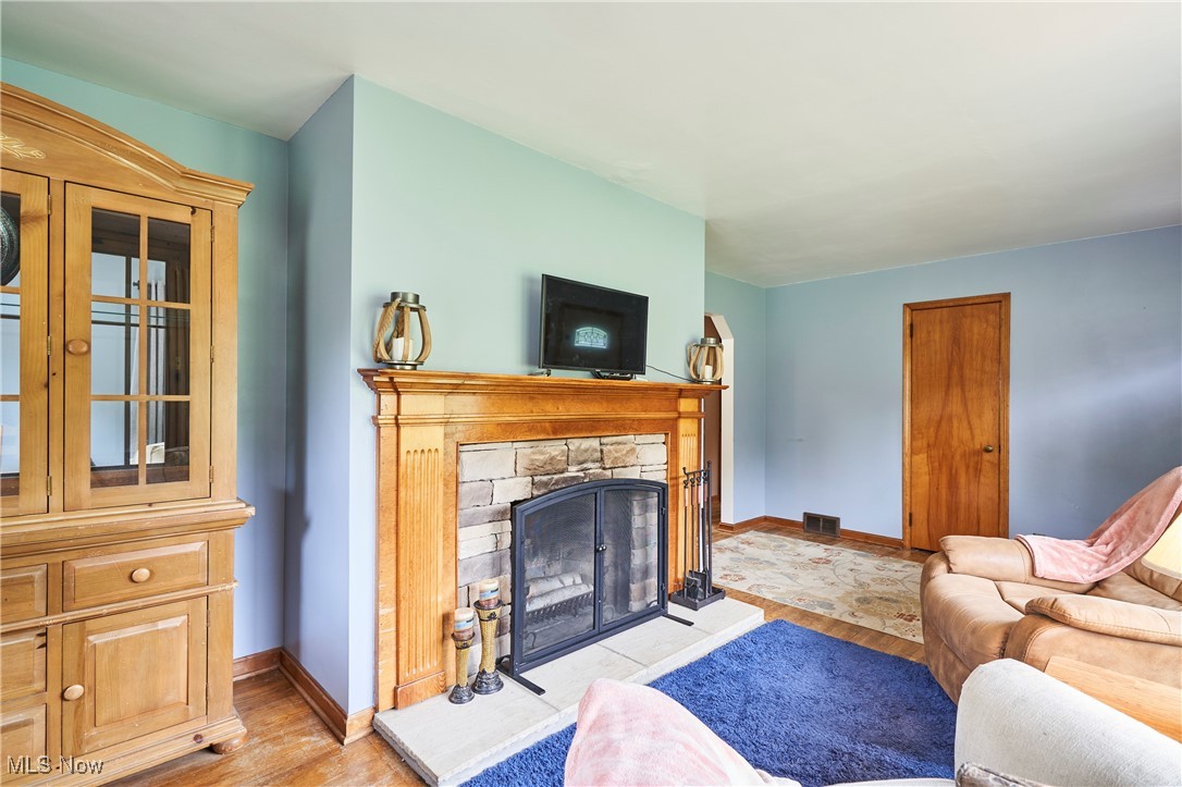 1433 Raleigh Boulevard Akron, OH 44321 - Photo 4 of 25 Living area with wood burning stone fireplace