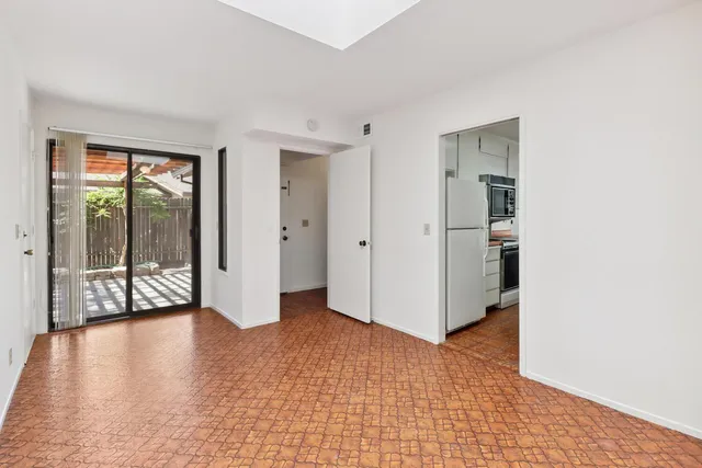 a view of a livingroom with wooden floor