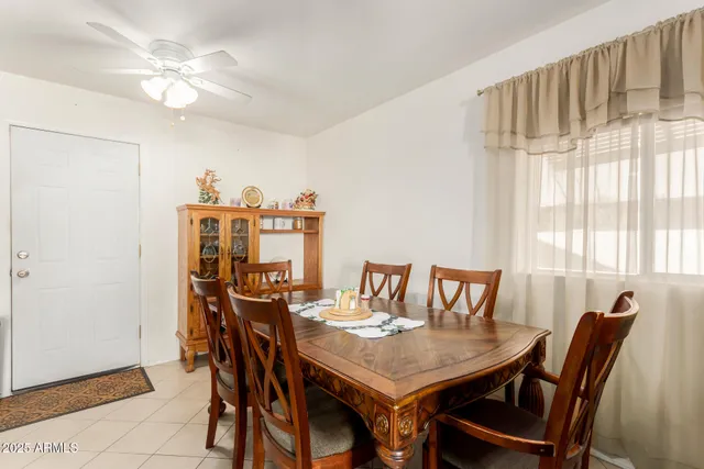 a view of a dining room and livingroom with furniture