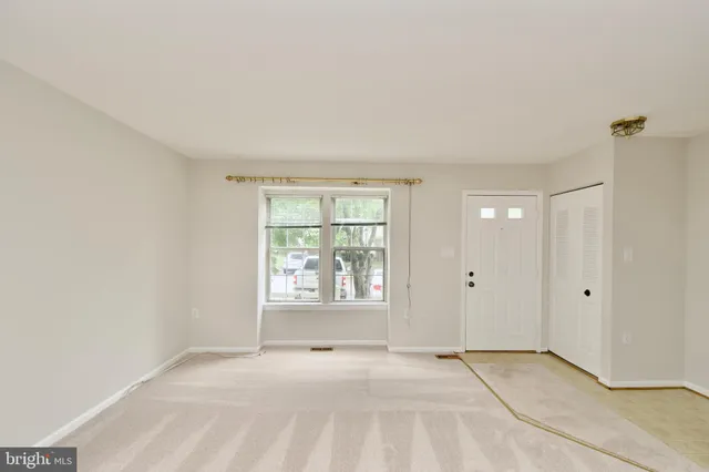a view of an empty room and window