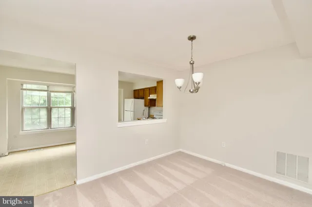 a view of room with wooden floor