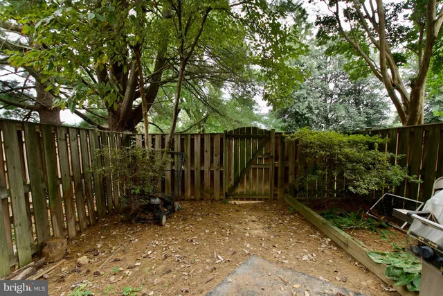a view of wooden deck with a backyard