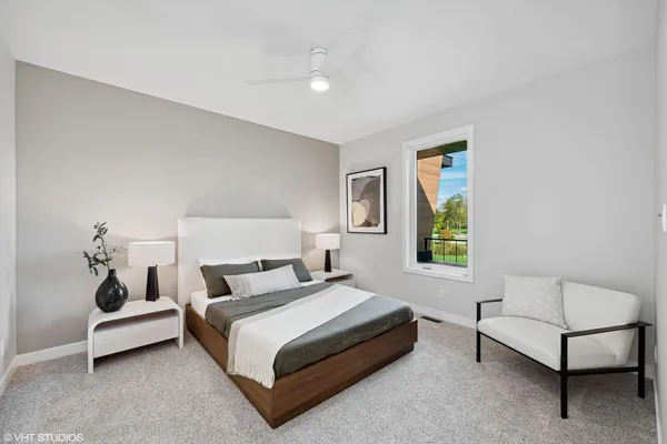 a bedroom with a bed and a couch