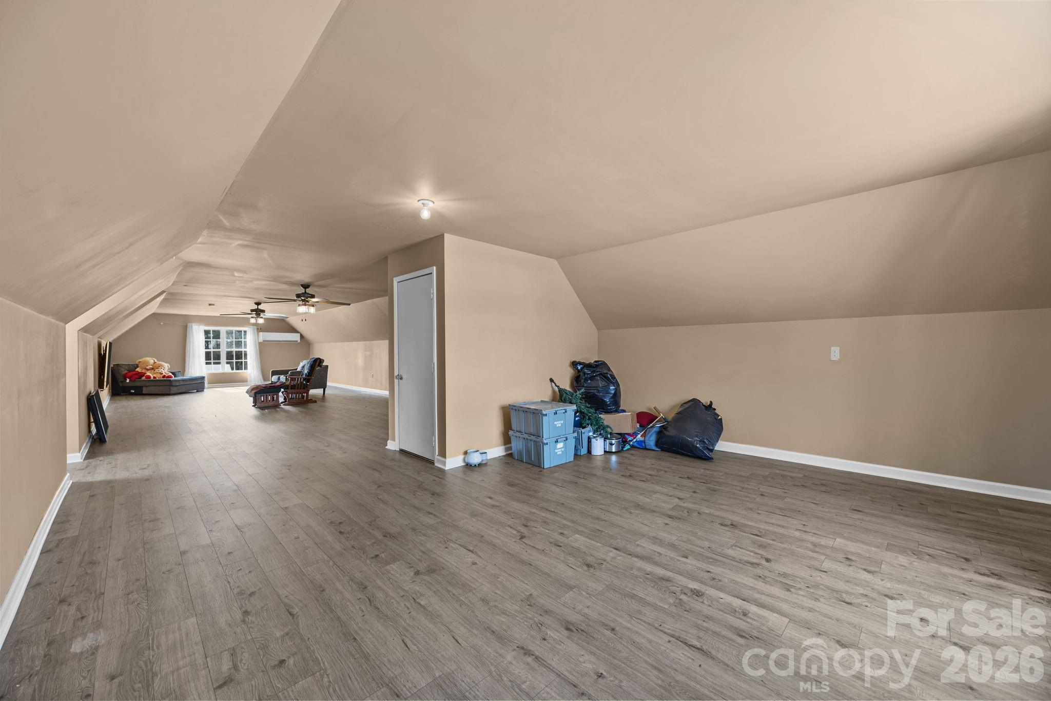 4275 Bethany Church Road Claremont, NC 28610 - Photo 11 of 39 a view of a livingroom with couch and a ceiling fan