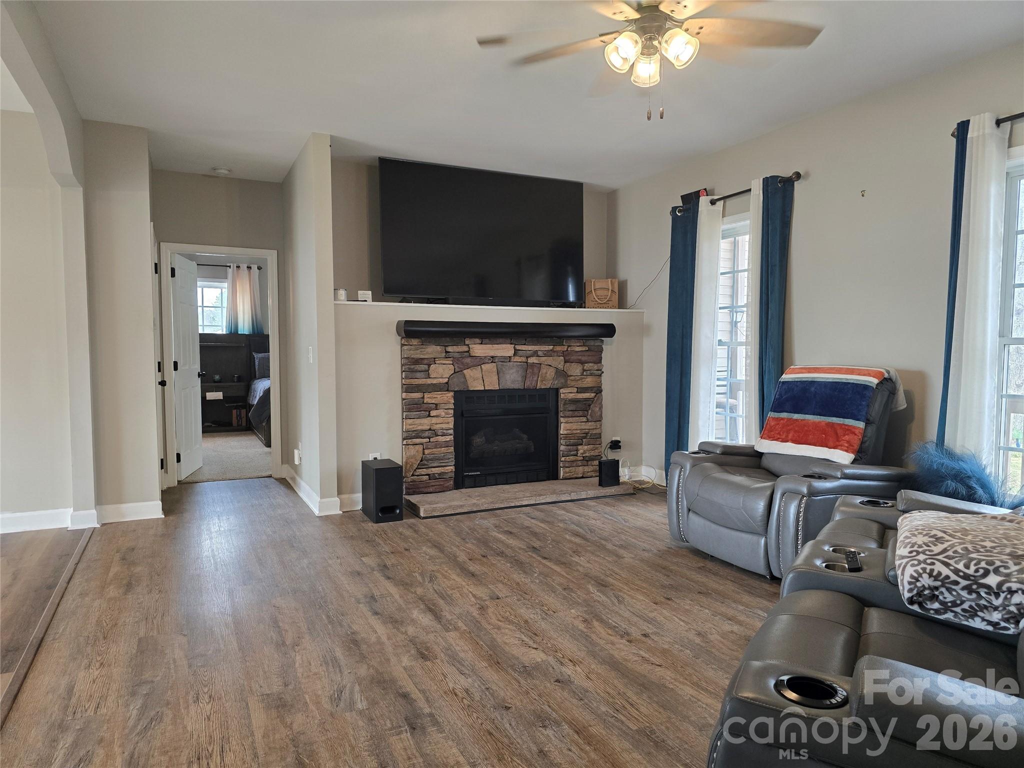 4275 Bethany Church Road Claremont, NC 28610 - Photo 18 of 39 a living room with furniture and a flat screen tv