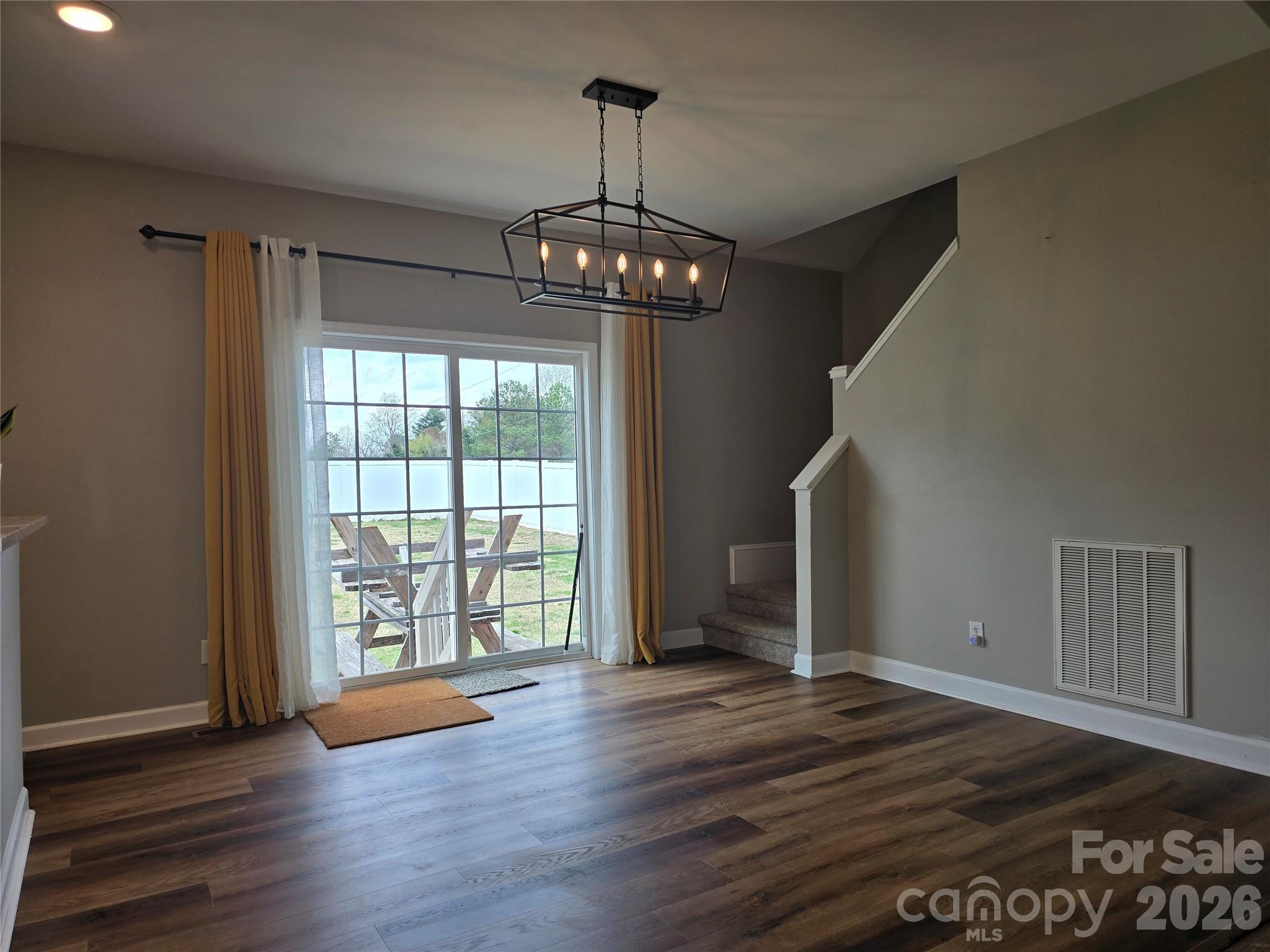 4275 Bethany Church Road Claremont, NC 28610 - Photo 31 of 39 a view of an empty room with wooden floor and a window