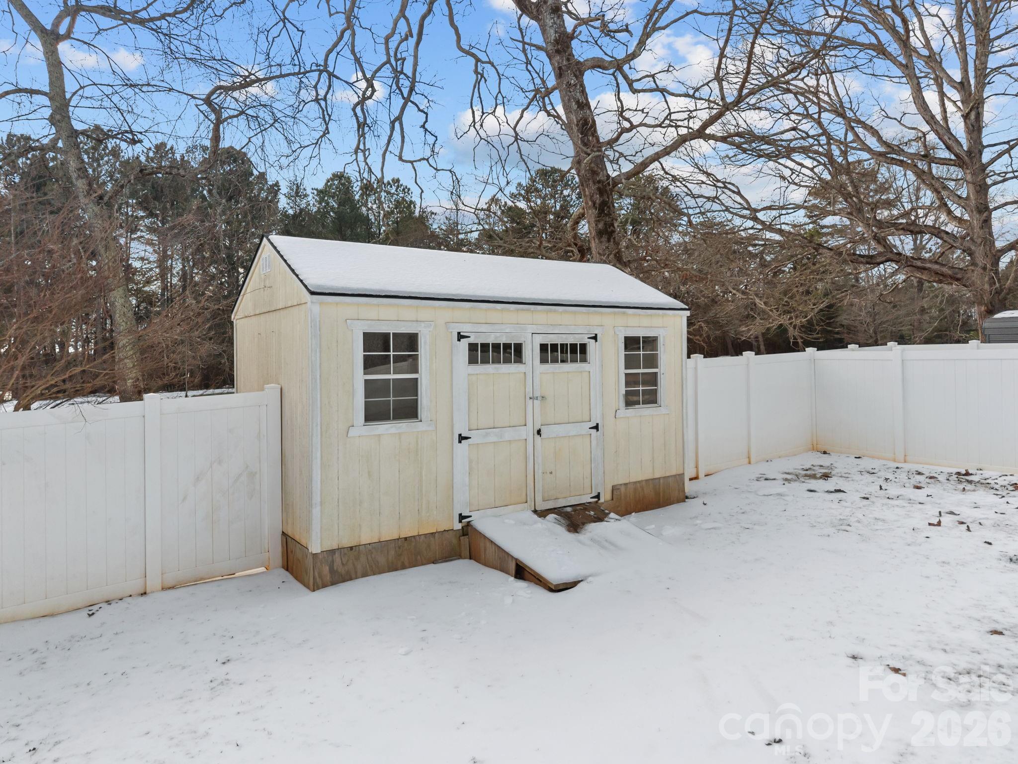 4275 Bethany Church Road Claremont, NC 28610 - Photo 35 of 39 a view of a house with a snow in the yard