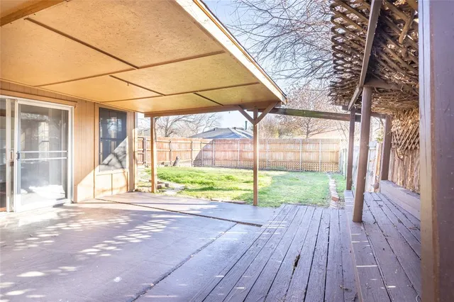 a view of a house with wooden floor and a yard