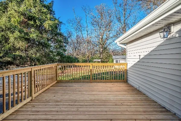 a view of deck with wooden floor and fence