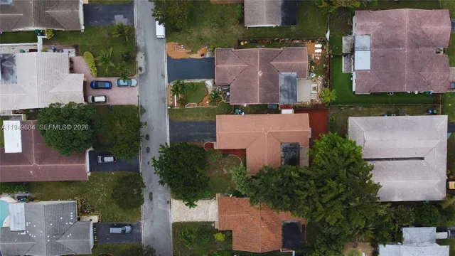 an aerial view of multiple houses with outdoor space