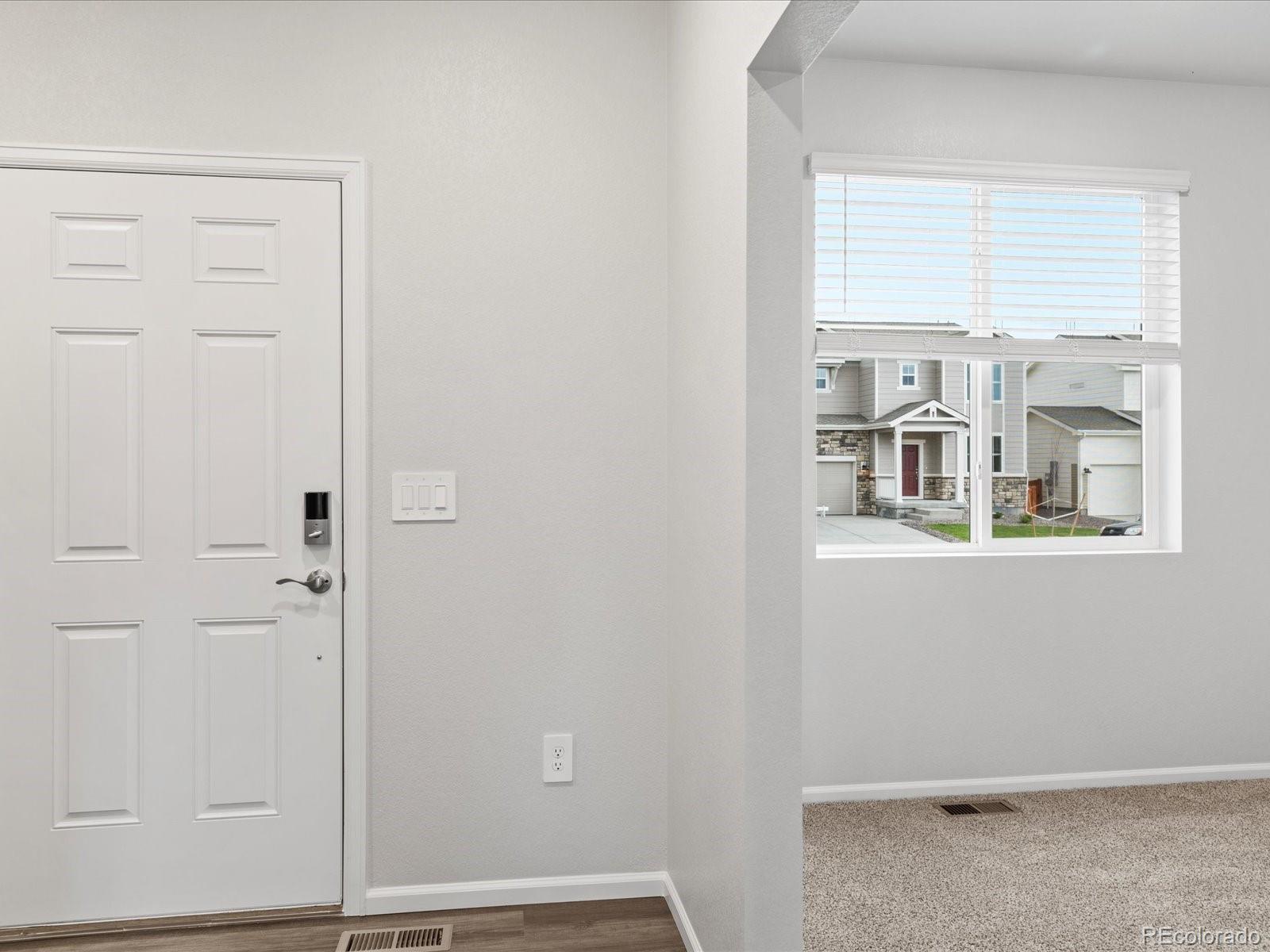 7331 West 27th Street Greeley, CO 80634 - Photo 2 of 40 an entryway with wooden floor