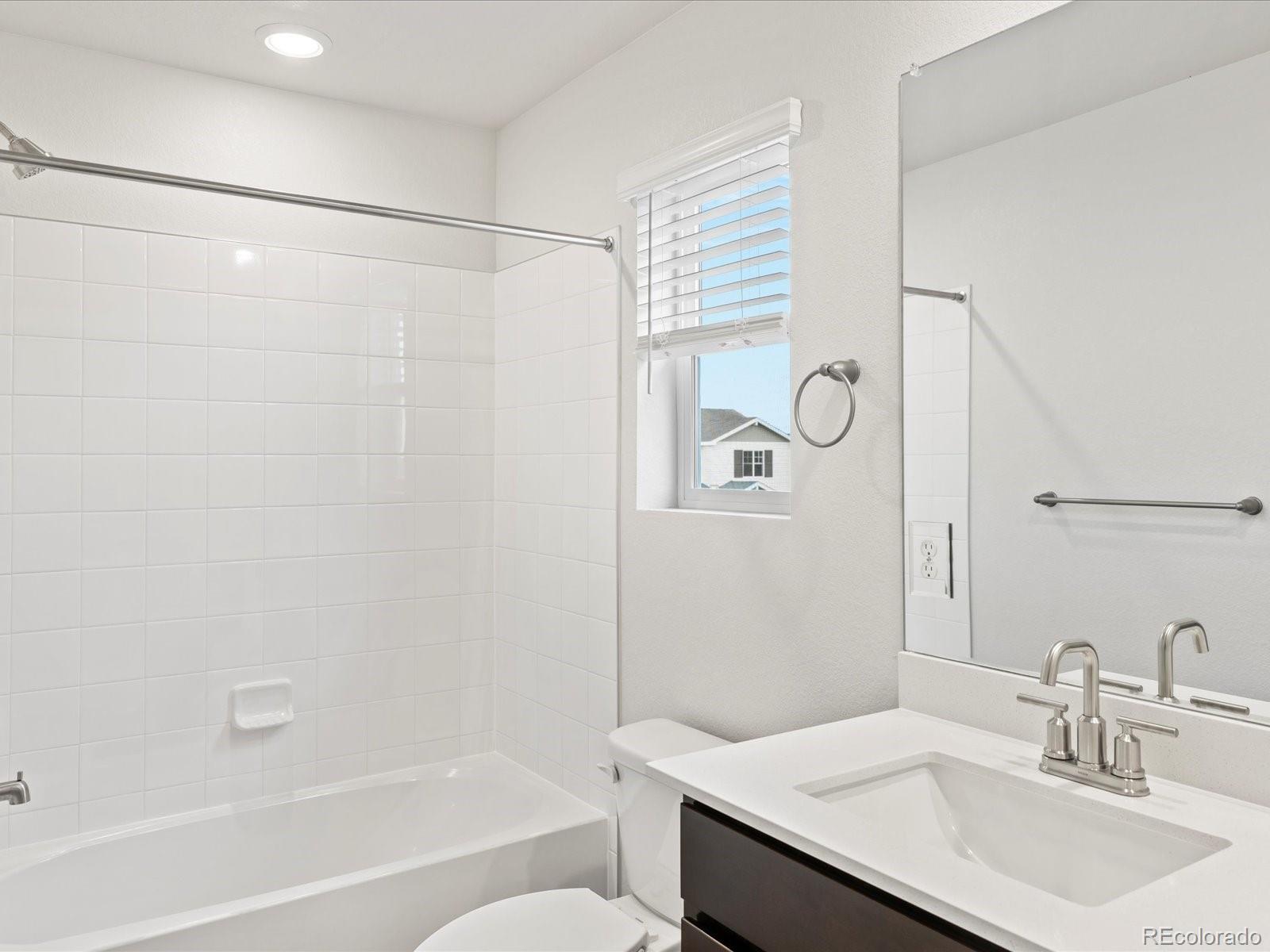 7331 West 27th Street Greeley, CO 80634 - Photo 28 of 40 a bathroom with a sink and a mirror