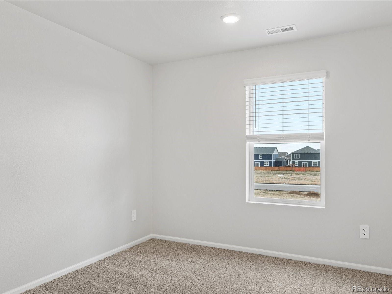 7331 West 27th Street Greeley, CO 80634 - Photo 29 of 40 an empty room with windows