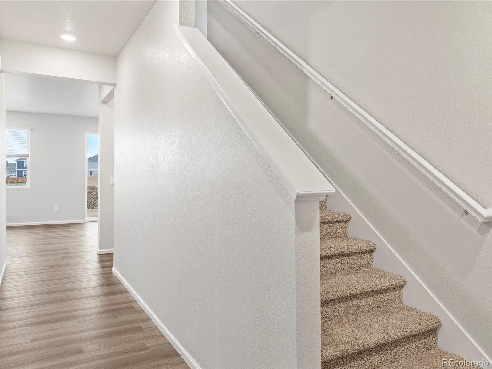 7331 West 27th Street Greeley, CO 80634 - Photo 3 of 40 a view of entryway and hall with wooden floor