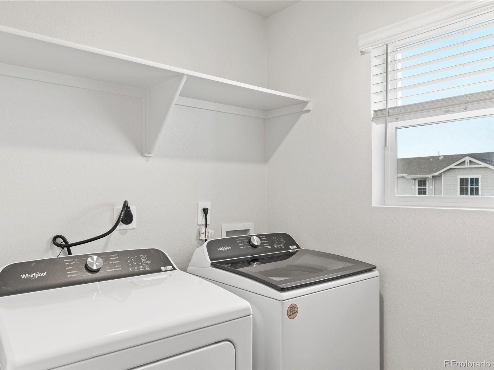 7331 West 27th Street Greeley, CO 80634 - Photo 32 of 40 a utility room with dryer and washer