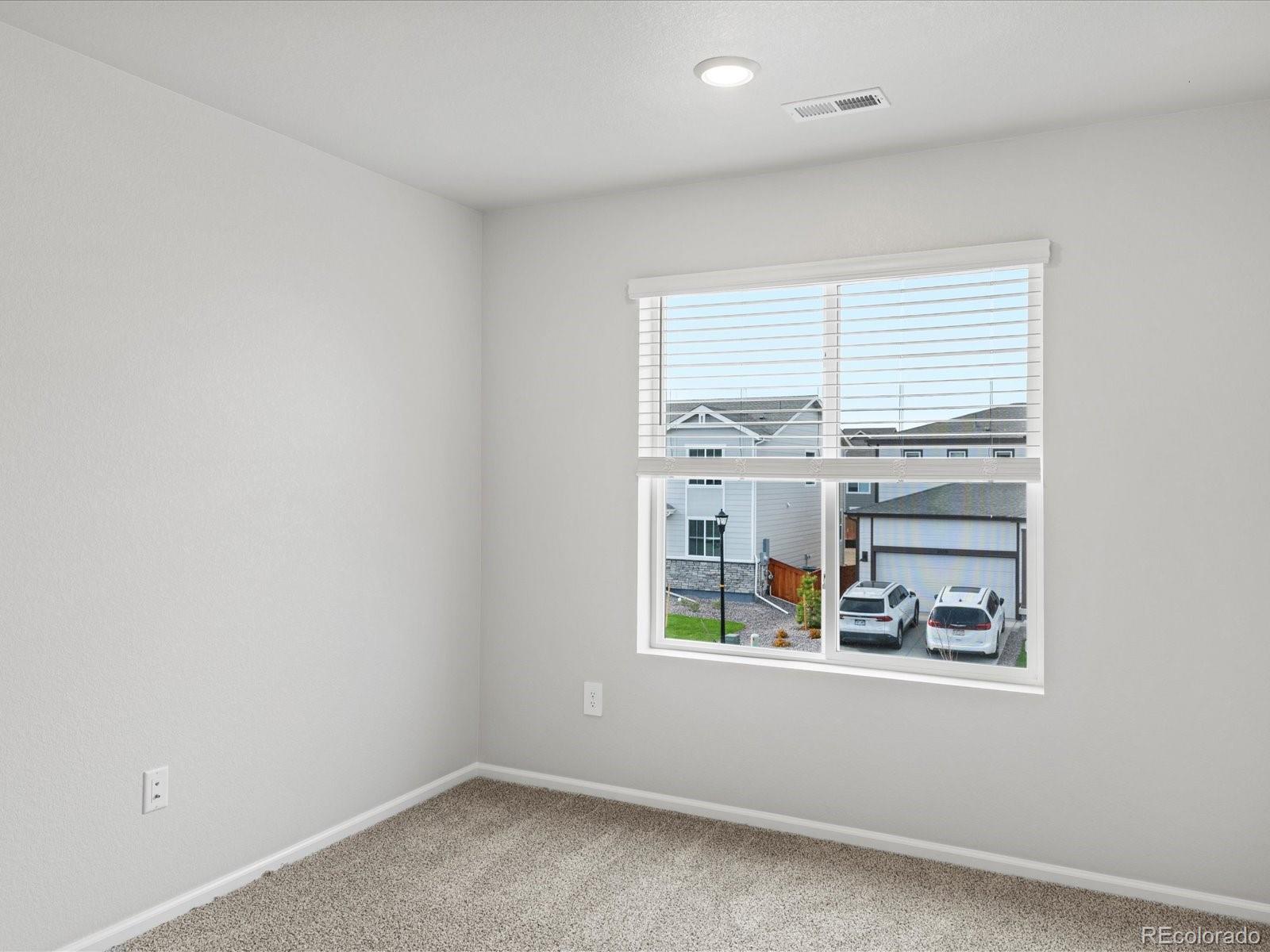 7331 West 27th Street Greeley, CO 80634 - Photo 36 of 40 an empty room with windows and entrance