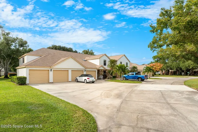 a view of a house with outdoor space and tree s