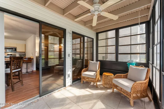 a balcony with furniture and a chandelier
