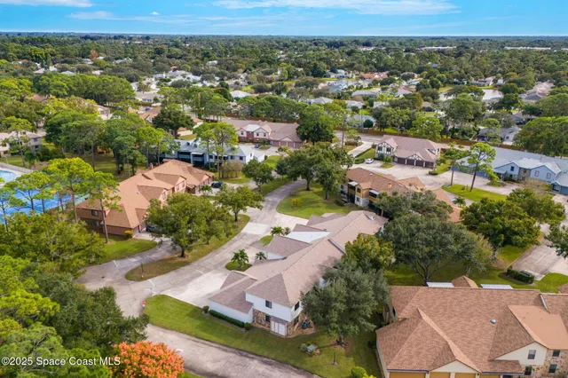 an aerial view of a house with a garden